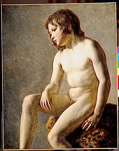 Jeune garçon assis
