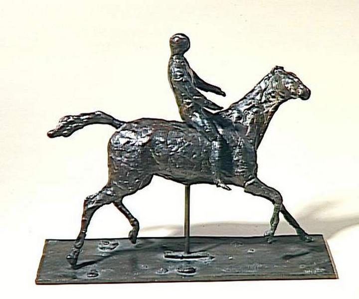 CHEVAL AU GALOP TOURNANT LA TETE A DROITE ; JOCKEY