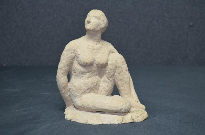 FEMME NUE ACCROUPIE