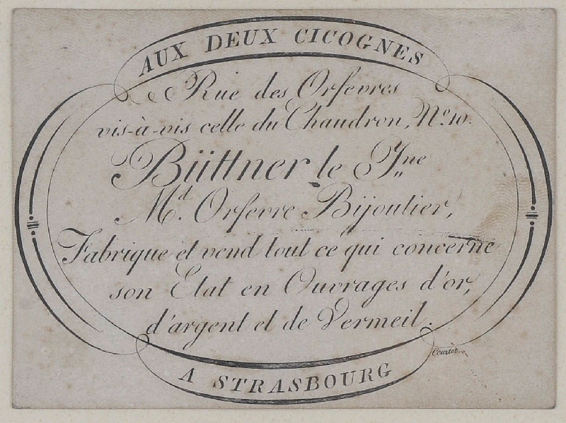 Etiquette de firme d'orfèvre ; Büttner le jeune (Rue des Orfèvres vis-à-vis celle du Chaudron N°10 MOrfèvre-Bijoutier Fabrique et vend tout ce qui concerne son Etat en ouvrages d'or, d'argent et de vermeil)