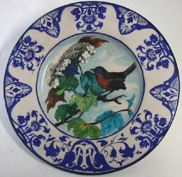 Plat tondino à décor d'oiseau sur une branche