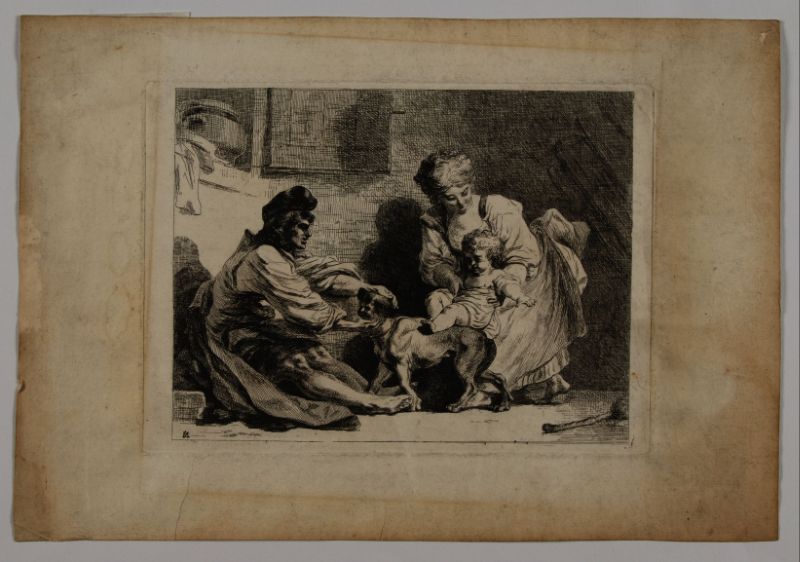 Homme et femme jouant avec un enfant et un chien