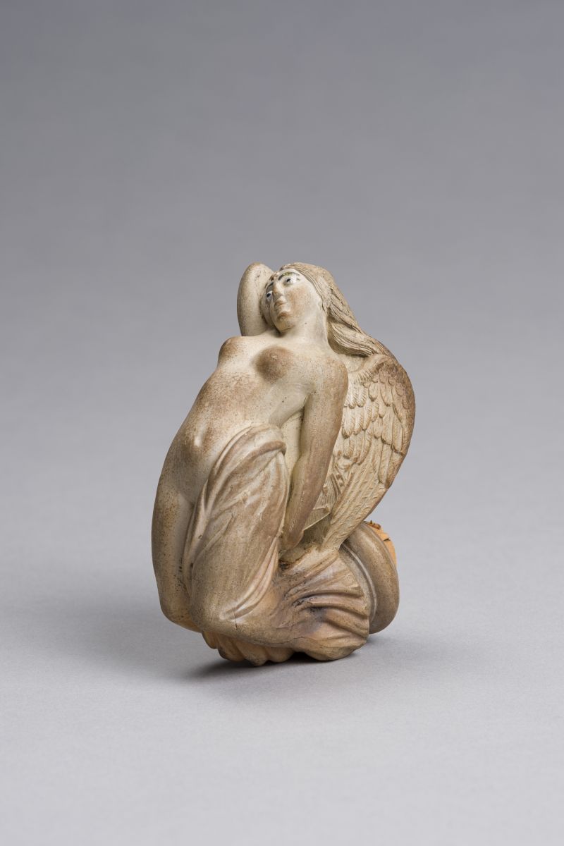 Tête de pipe avec sirène en figure de proue