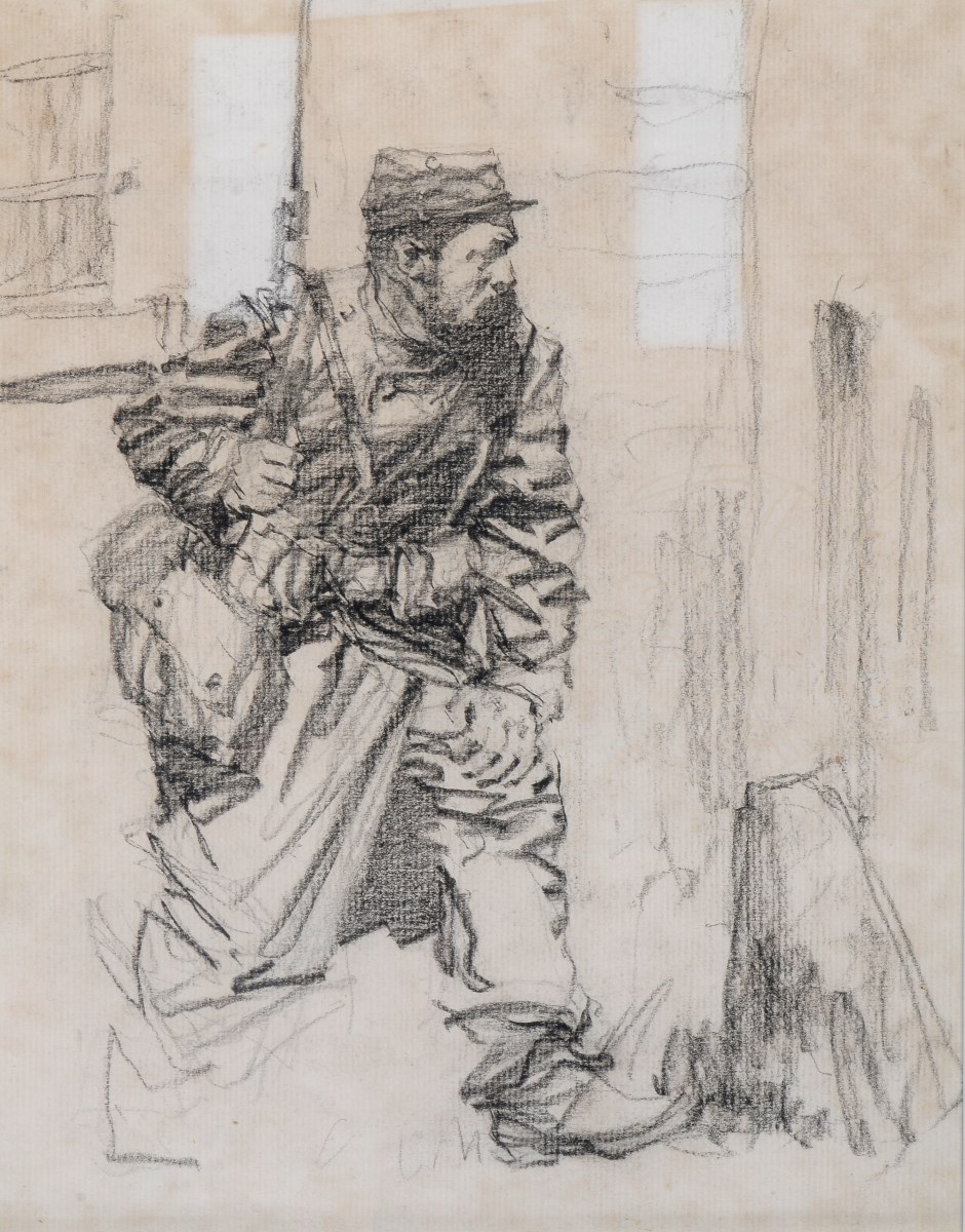 Soldat français en observation au coin d'un bâtiment