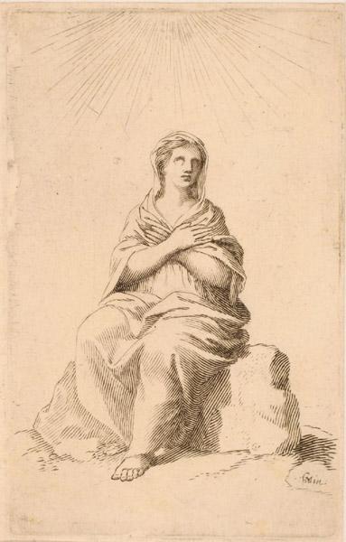 Femme en prières assise sur un rocher