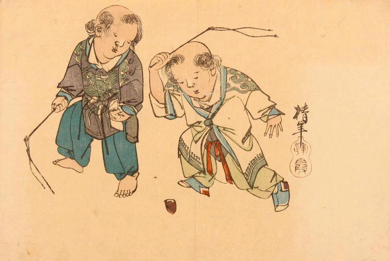 Deux enfants jouant avec une toupie