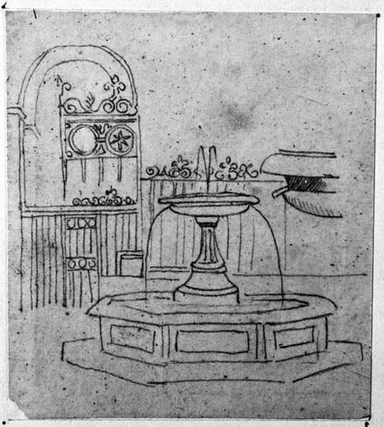 Une fontaine devant une grille en fer forgé