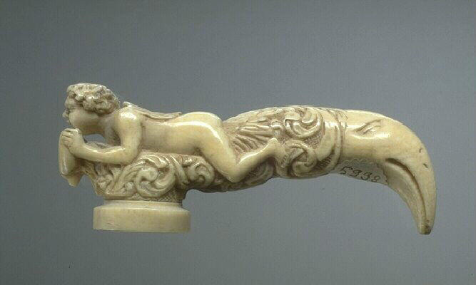 Amour ailé chevauchant un oiseau