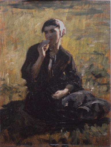 Femme assise dans un pré