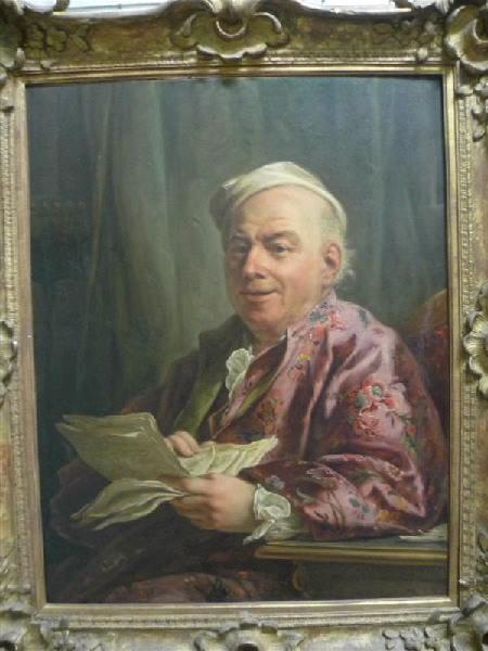 Portrait d'homme assis à sa table de travail