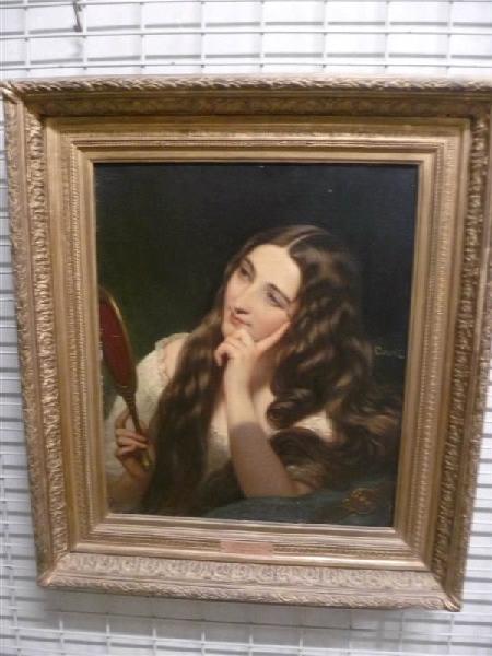 Jeune fille tenant un miroir