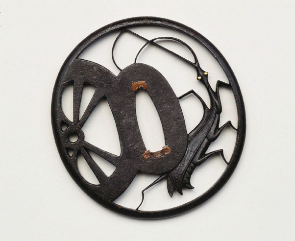 Garde de sabre à décor de mante religieuse