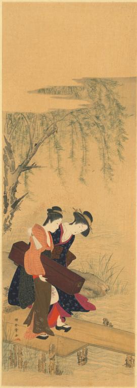 Deux jeunes femmes sur un pont de bois