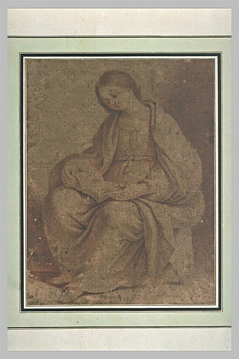 Une jeune femme assise et lisant