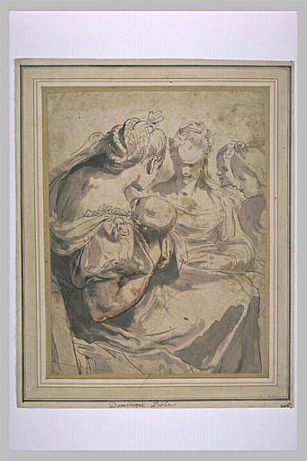 Trois femmes regardant une femme tenant un enfant