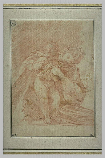 Une femme accroupie plaçant des fruits dans la chemise d'un enfant