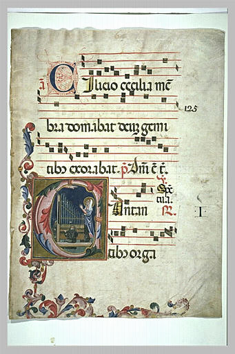 Lettre C ornée : un moine jouant de l'orgue, et une sainte