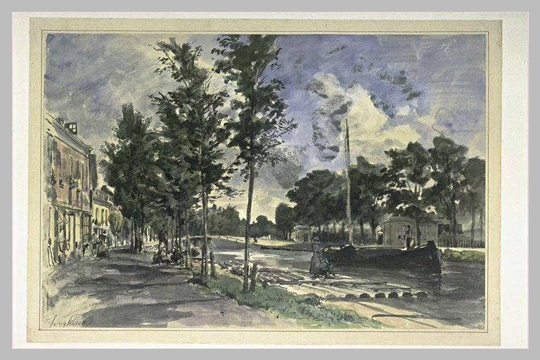 Un chaland sur un canal bordé de maisons