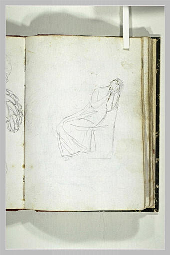 Femme assise dans un fauteuil