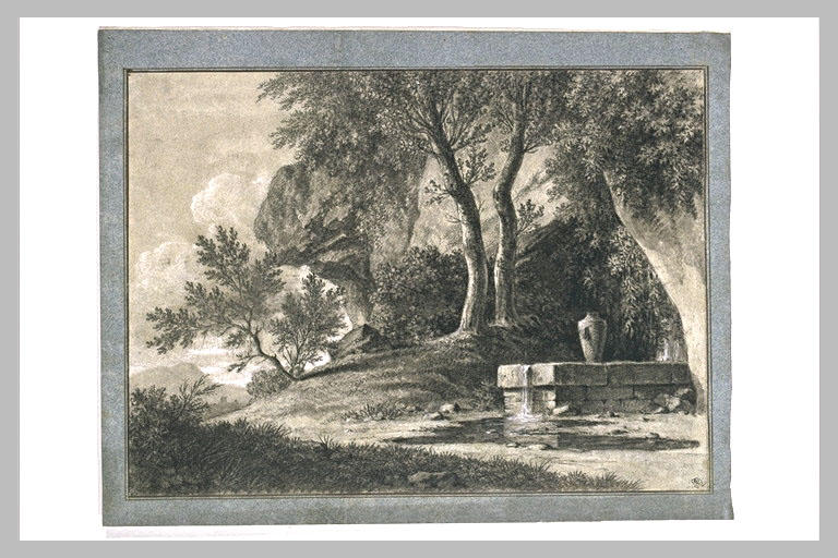 Arbres, devant une paroi rocheuse, abritant une fontaine