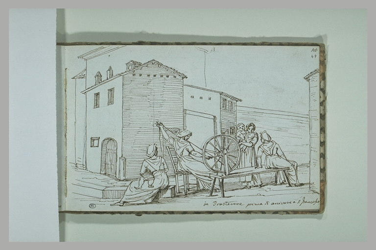 Groupe de femmes dans une rue, dont l'une file de la laine