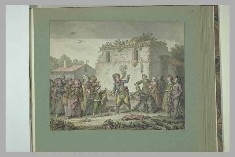 Un cracheur de feu s'exécutant devant de nombreux villageois