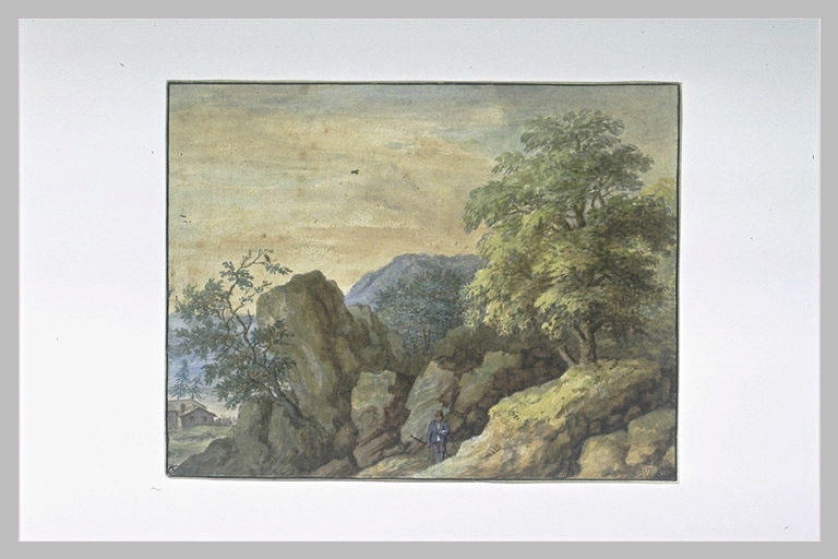 Paysage : un homme debout parmi des rochers