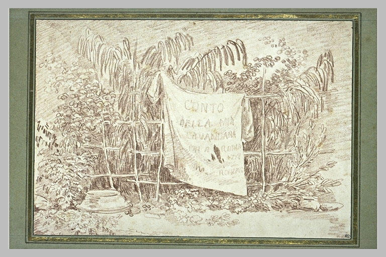 Linge séchant sur une barrière de roseaux