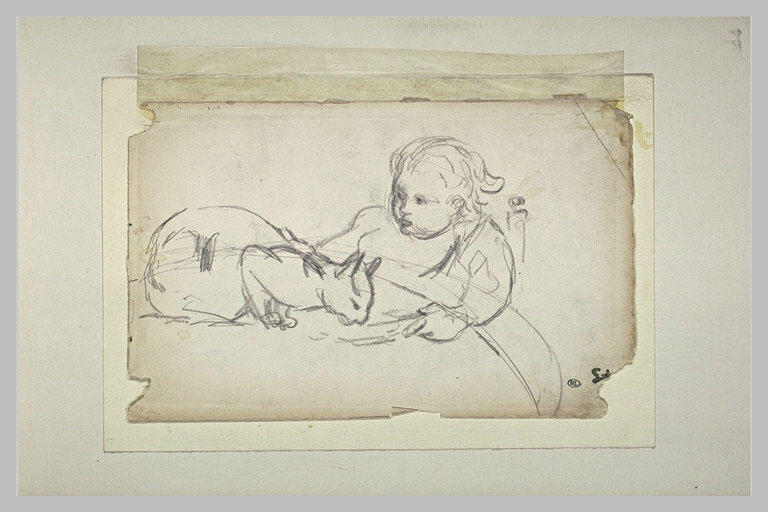 Enfant assis donnant à boire à un chat