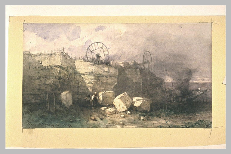 Une carrière de pierres, avec deux ouvriers près de gros blocs