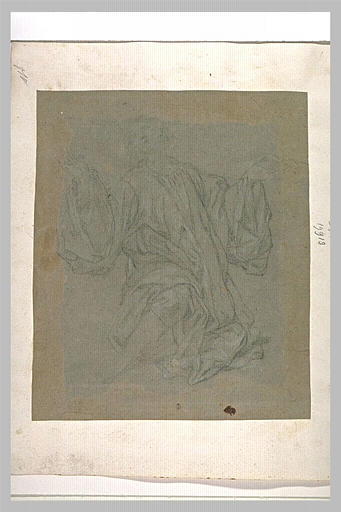 Un homme à genoux, les bras ouverts, regardant au ciel