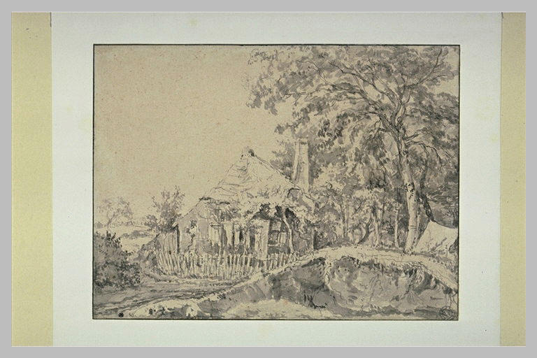 Vieille ferme entourée d'échalas, à la lisière d'un bois