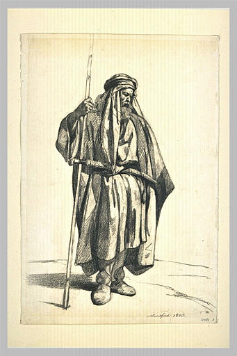 Oriental barbu, debout, de trois quarts à droite, en burnous