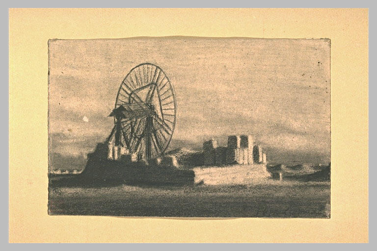 Plate-forme de pierre avec une grande roue au milieu d'un terrain nu