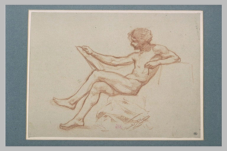 Jeune homme, assis jambes croisées, tenant un carton et un compas