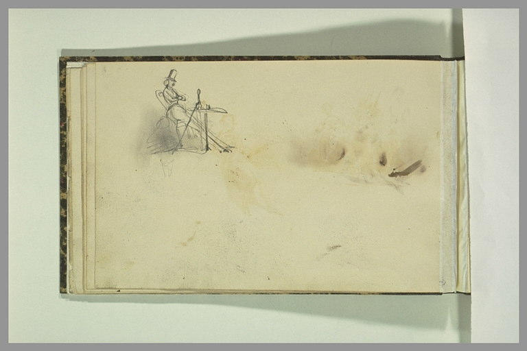 Un personnage assis à une table