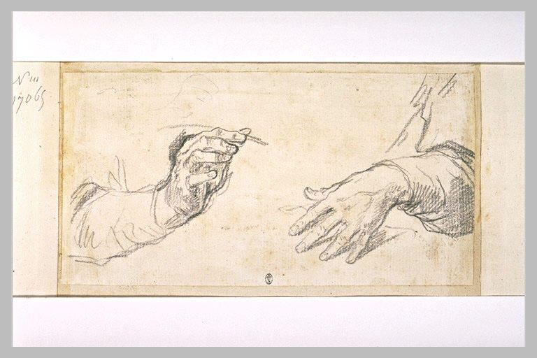 Main tenant une plume, et main posée