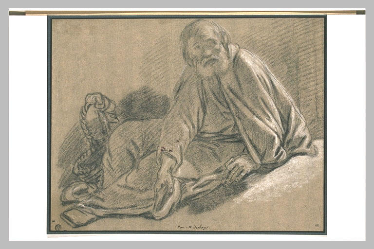 Un frère quêteur, assis, tenant son chapeau à la main