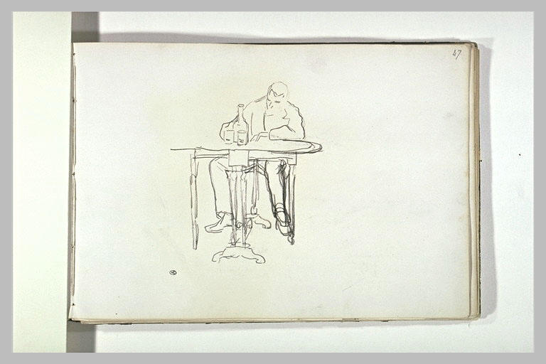 Homme attablé devant deux verres et une bouteille