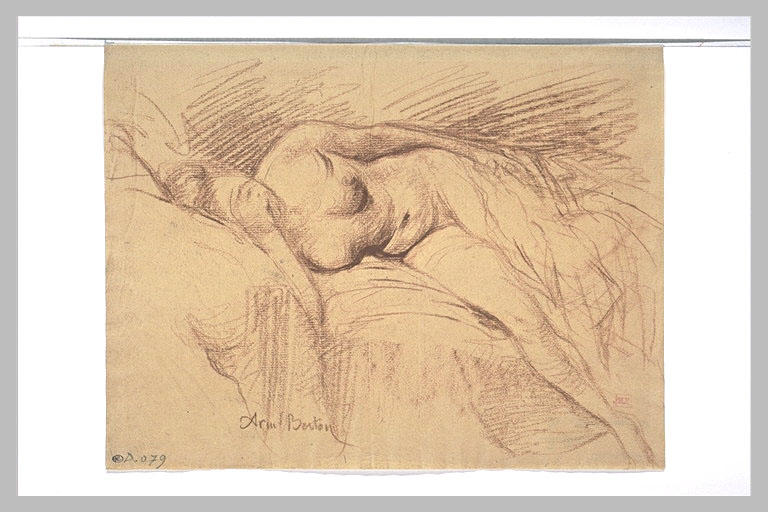 Femme nue couchée sur un lit