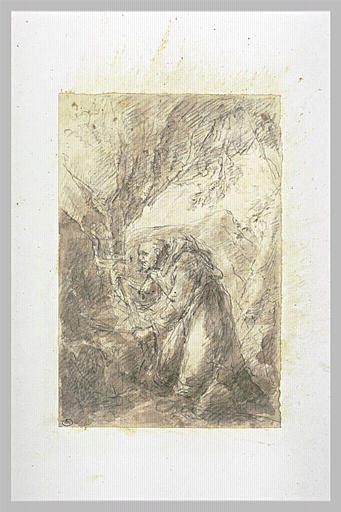 Saint François d'Assise agenouillé à l'entrée d'une grotte