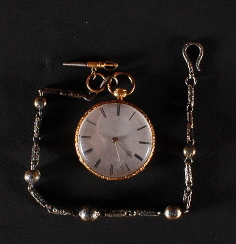 Montre en or et sa chaîne portant gravée sur le boîtier l'inscription : Souvenir d'Espagne offert par S.A.R. Mme la Princesse Adélaïde à M. Dauzat.
