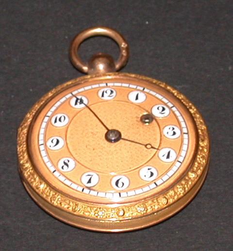 Montre en or, cadran émail blanc