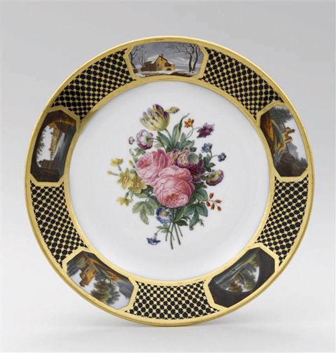 Assiette à dessert en porcelaine de Paris, marquées Feuillet au revers, marli à décor de résille dorée fond bleu orné de 5 cartouches topographiques