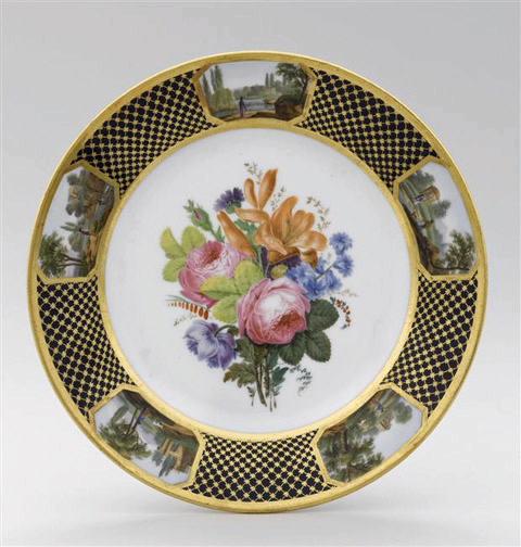 Assiette à dessert en porcelaine de Paris, marquées Feuillet au revers, marli à décor de résille dorée fond bleu orné de 5 cartouches topographiques