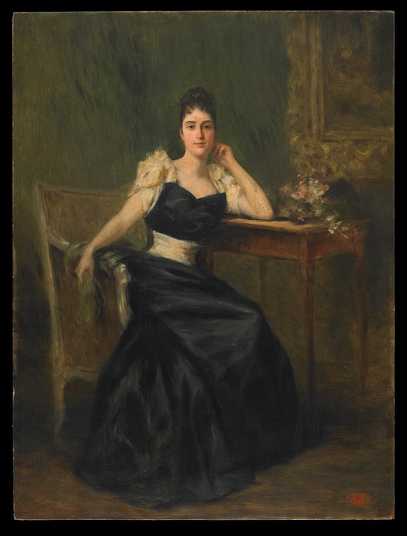 Portrait de femme assise en toilette du soir