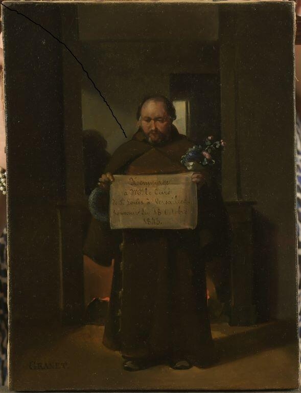 Capucin tenant des fleurs