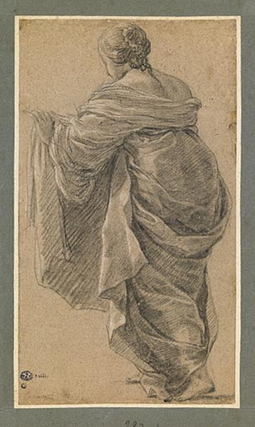 Femme debout vue de dos, tenant un linge