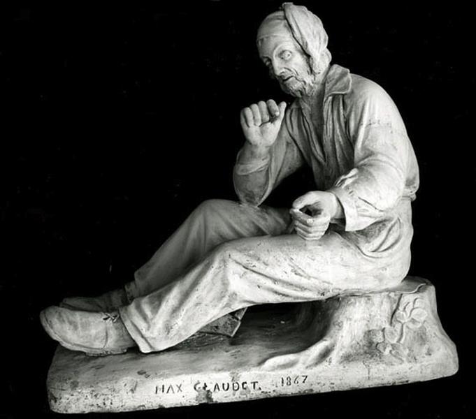 Bûcheron allumant sa pipe