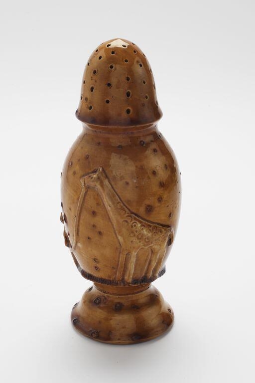 Sucrier à la girafe en laisse avec un palmier